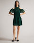 POPPIO-Dresses-Turn heads in POPPIO. Crafted from a lightweight material with a slightly sheer effect, this playful mini dress features a tiered skirt and braided trims that accentuate the look. Pair it with statement jewellery for added drama.The fabric of this product is made with 55% recycled polyester. Using recycled polyester helps divert plastic waste from ending in landfills. Mini dress Rope details High neck Short sleeves Cold shoulder Tiered skirt Concealed fastening Chae is 5'9.5" / 1.77m and wear
